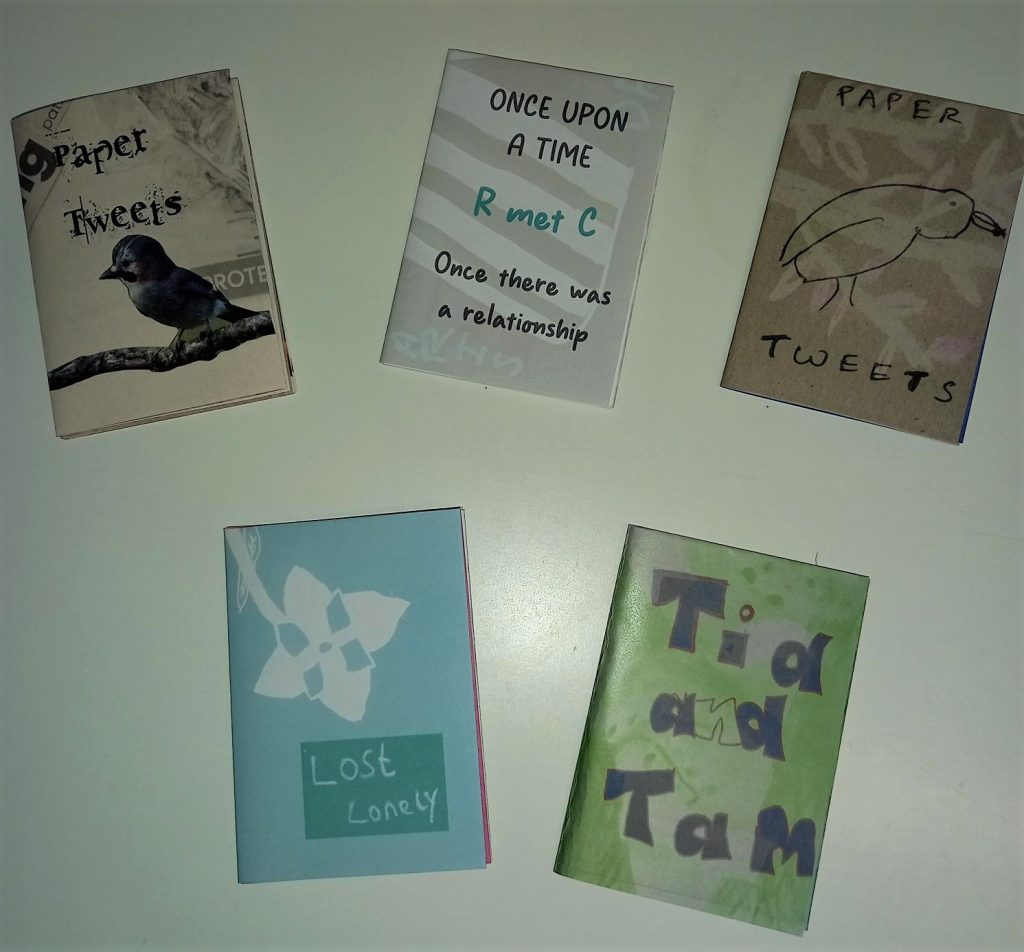 The front covers of five zines.