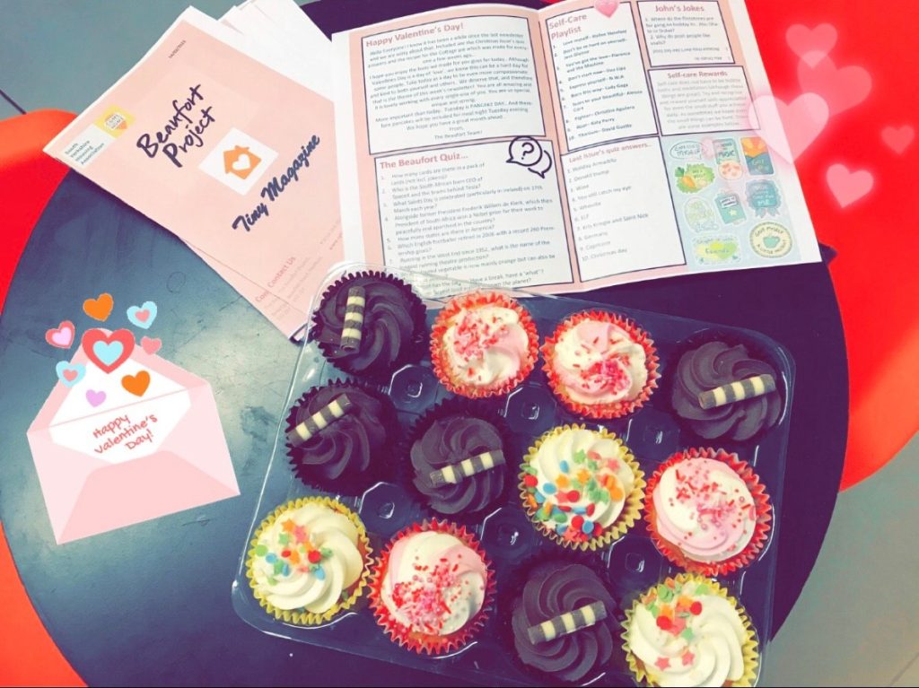 Beaufort's 'tiny magazine' - a publication that is created for our customers. This one is the Valentine's day edition, and is shown next to some cupcakes.